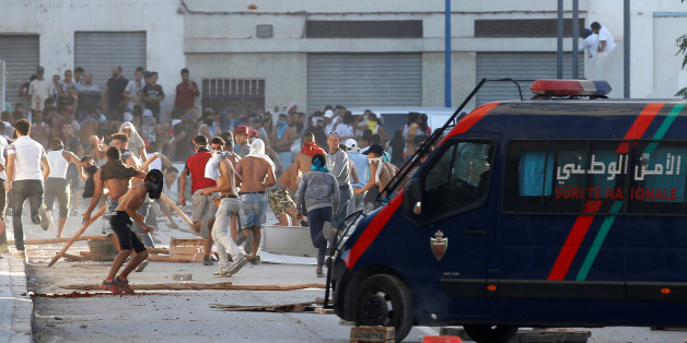 Protesters throw stones against riot police during a demonstration against alleged corruption in the town of Al-Hoceima, Morocco July 20, 2017. REUTERS/Youssef Boudlal