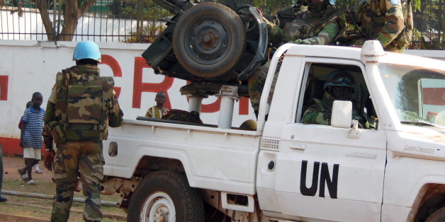 U.N. peacekeepers take a break as they patrol along a street during the presidential election in Bangui, the capital of Central African Republic, December 30, 2015. REUTERS/Media Coulibaly