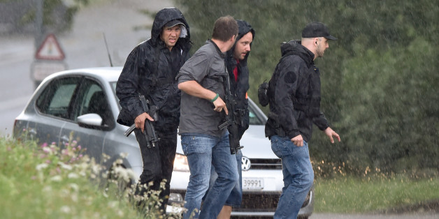 Police officers walk under heavy rain during the hunting in Uhwiesen northern Switzerland, of a man armed with a chainsaw who injured at least five people in Schaffhausen on July 24, 2017.
A man armed with a chainsaw injured at least five people in Switzerland on Monday and is on the run after a rampage that police said was not 'a terrorist act'. The assailant entered an office building in the northern town of Schaffhausen shortly after 10:30 am (0830 GMT), police said in a statement cited by multiple local media outlets. / AFP PHOTO / MICHAEL BUHOLZER (Photo credit should read MICHAEL BUHOLZER/AFP/Getty Images)