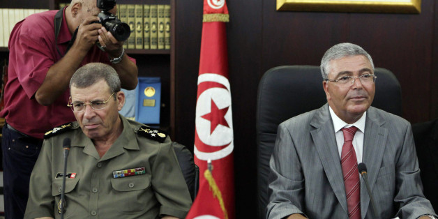 Tunisia's Armed Forces General Rachid Ammar (L) and Tunisian Defence Minister Abdelkarim Zbidi attend a meeting with U.S. Defense Secretary Leon Panetta (not in picture) in Tunis July 30, 2012. REUTERS/Zoubeir Souissi (TUNISIA - Tags: POLITICS MILITARY)