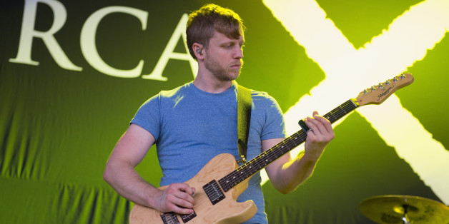 TINLEY PARK, IL - AUGUST 22: (Images can not be used in publications or biographies devoted solely to the artist) Brendan Ekstrom of Circa Survive performs on stage at 2013 Rockstar Energy UPROAR Festival at First Midwest Bank Amphitheatre on August 22, 2013 in Tinley Park, Illinois. (Photo by Daniel Boczarski/Redferns via Getty Images)