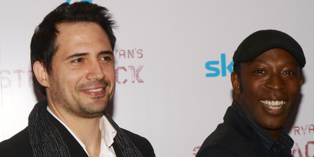 Tunisian actor Dhafer L'Abidine and British actor Shaun Parkes pose upon arrival for the premiere of their latest film, 'Strike Back ' in London's Leicester Square, on April 15, 2010. AFP PHOTO/MAX NASH (Photo credit should read MAX NASH/AFP/Getty Images)