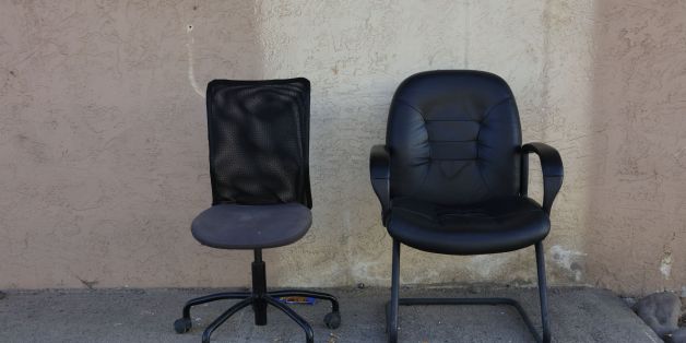 Two office chairs sit in front of western building in Montrose Colorado.. (Photo by: Visions of America/UIG via Getty Images)