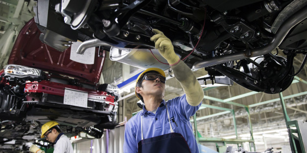 Workers assemble Subaru branded vehicles on the production line of Fuji Heavy Industries Ltd.'s Gunma Yajima Plant in Ota, Gunma, Japan, on Thursday, March 30, 2017. Fuji Heavy, best known for its Subaru brand of cars, will change its name to Subaru Corp. from April 1. Photographer: Tomohiro Ohsumi/Bloomberg via Getty Images