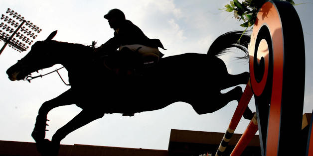 Egyptian Abdul Qader Said clears an obstacle with his horse during the equestrian jumping competition during the 11th Pan-Arab Games in Cairo,15 November 2007. The Games are a regional multi-sport event held between nations from the Arab world for two weeks. AFP PHOTO/KARIM JAAFAR (Photo credit should read KARIM JAAFAR/AFP/Getty Images)