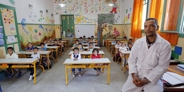Teacher Moulay Ismael Lamrani poses for a picture with his class in the Oudaya primary school in Rabat, September 15, 2015, at the start of the new school year in Morocco. Nearly three years after Taliban gunmen shot Pakistani schoolgirl Malala Yousafzai, the teenage activist last week urged world leaders gathered in New York to help millions more children go to school. World Teachers' Day falls on 5 October, a Unesco initiative highlighting the work of educators struggling to teach children ami
