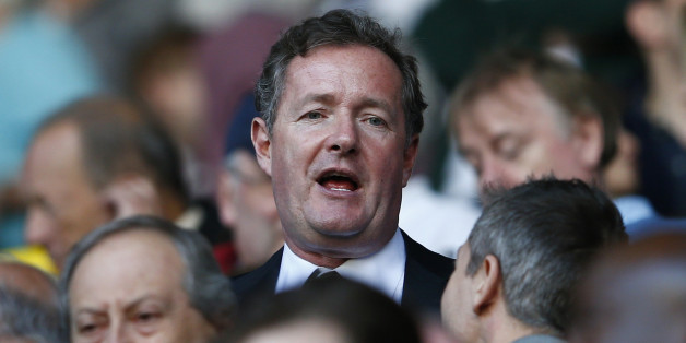Former newspaper editor Piers Morgan takes his seat in the stand before Arsenal play Tottenham Hotspur in their English Premier League soccer match at White Hart Lane in London, March 16, 2014. REUTERS/Eddie Keogh (BRITAIN - Tags: SPORT SOCCER MEDIA) FOR EDITORIAL USE ONLY. NOT FOR SALE FOR MARKETING OR ADVERTISING CAMPAIGNS. NO USE WITH UNAUTHORIZED AUDIO, VIDEO, DATA, FIXTURE LISTS, CLUB/LEAGUE LOGOS OR "LIVE" SERVICES. ONLINE IN-MATCH USE LIMITED TO 45 IMAGES, NO VIDEO EMULATION. NO USE IN BE
