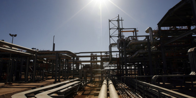 ALGERIA - DECEMBER 14: The In Salah Gas (ISG) Krechba Project, run by Sonatrach, British Petroleum (BP), and StatoilHydro, operates in the Sahara desert near In Salah, Algeria, on Sunday, Dec. 14, 2008. From produced gas, the carbon capture plant, the largest and first of its kind, removes annually the carbon dioxide emissions equivalent of 200,000 automobiles running 30,000 kilometers. The CO2 is then reinjected into a two-kilometer deep reservoir instead of the atmosphere, with the intention