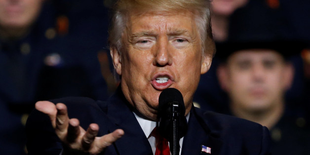 U.S. President Donald Trump delivers remarks about his proposed U.S. government effort against the street gang Mara Salvatrucha, or MS-13, to a gathering of federal, state and local law enforcement officials in Brentwood, New York, U.S. July 28, 2017. REUTERS/Jonathan Ernst