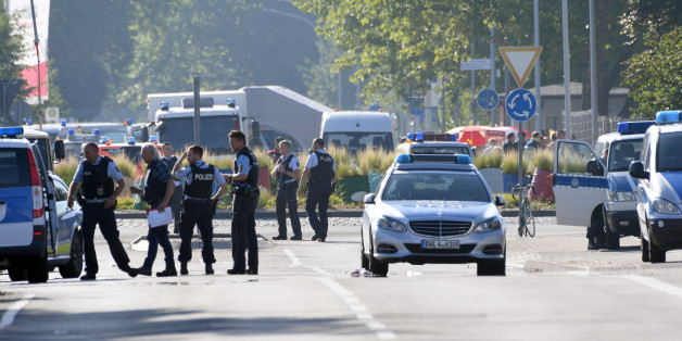 Police and ambulances stand near the disco Club Grey in the southern German town of Konstanz, where a gunman opened fire, killing one and wounding four people before being shot by police, on July 30, 2017. The 34-year-old attacker 'was critically injured in a shootout with police officers as he left the disco, and later succumbed to his wounds in hospital,' police said in a statement. / AFP PHOTO / dpa / Felix Kästle / Germany OUT (Photo credit should read FELIX KASTLE/AFP/Getty Images