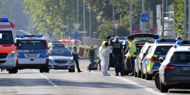 Police and ambulances stand near the disco Club Grey in the southern German town of Konstanz, where a gunman opened fire, killing one and wounding four people before being shot by police, on July 30, 2017. The 34-year-old attacker 'was critically injured in a shootout with police officers as he left the disco, and later succumbed to his wounds in hospital,' police said in a statement. / AFP PHOTO / dpa / Felix Kästle / Germany OUT (Photo credit should read FELIX KASTLE/AFP/Getty Images