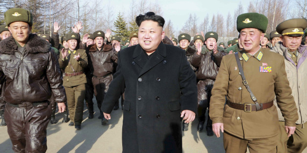 North Korean leader Kim Jong Un walks as he inspects the KPA Air and Anti-Air Force Unit 991, honoured with the title of O Jung Hup-led Seventh Regiment, in this undated photo released by North Korea's Korean Central News Agency (KCNA) in Pyongyang November 21, 2014. REUTERS/KCNA (NORTH KOREA - Tags: POLITICS MILITARY TRANSPORT)ATTENTION EDITORS - THIS PICTURE WAS PROVIDED BY A THIRD PARTY. REUTERS IS UNABLE TO INDEPENDENTLY VERIFY THE AUTHENTICITY, CONTENT, LOCATION OR DATE OF THIS IMAGE. FOR E