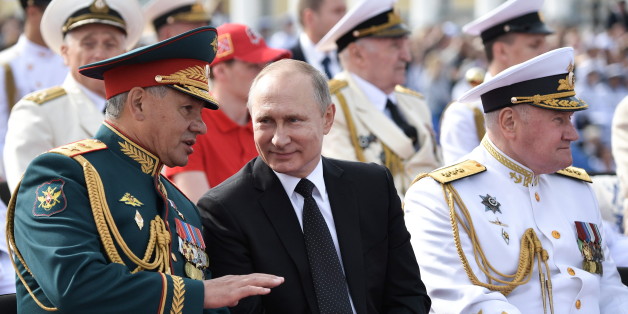 ST PETERSBURG, RUSSIA - JULY 30, 2017: Russia's defence minister Sergei Shoigu, president Vladimir Putin, and the commander in chief of the Russian Navy admiral Vladimir Korolev (L-R) review a naval parade marking the Day of the Russian Navy, from Senate Square overlooking the Neva River. Alexei Nikolsky/Russian Presidential Press and Information Office/TASS (Photo by Alexei Nikolsky\TASS via Getty Images)