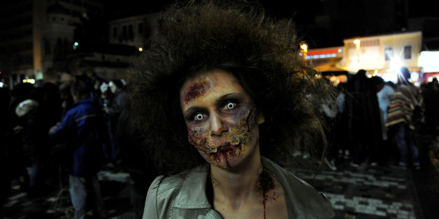 A woman dressed as zombie walks through the city centre during an annual "Zombie Walk" parade in Athens, Greece, February 25, 2017. REUTERS/Michalis Karagiannis