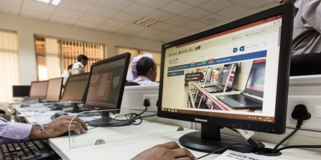 A trainee uses a mouse while sitting in front of a computer screen displaying the Government e Marketplace (GeM) website during a class at the National Institute of Financial Management in Faridabad, Haryana, India, on Wednesday, Nov. 2, 2016. India's Prime Minister Narendra Modi plans to move all government purchases, from paper clips to power plant turbines, to an Amazon-like online marketplace that could eventually be worth a fifth of the country's $2 trillion economy. Photographer: Udit Kuls