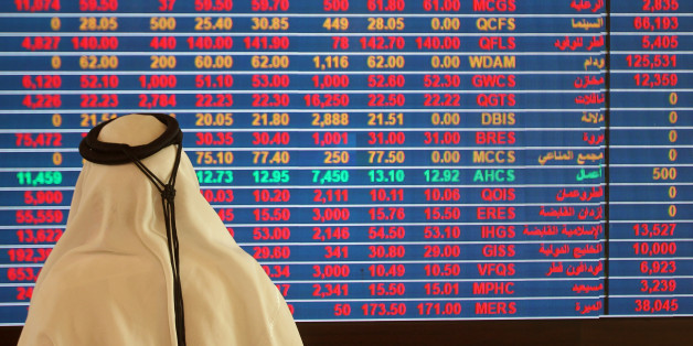 A trader monitors a screen displaying stock information at Qatar Stock Exchange in Doha, Qatar November 9, 2016. REUTERS/Naseem Zeitoon