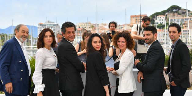(FromL) Algerian actor Mohamed Djouhri, French actress Aure Atika, Algerian actor Hassan Kachach, Algerian actress Hania Amar, Algerian actress Nadia Kaci, Algerian director Karim Moussaoui and Algerian actor Mehdi Ramdani pose on May 22, 2017 during a photocall for the film 'Until the Birds Return' (En Attendant les Hirondelles) at the 70th edition of the Cannes Film Festival in Cannes, southern France. / AFP PHOTO / LOIC VENANCE (Photo credit should read LOIC VENANCE/AFP/Getty Images)