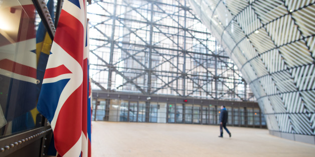 The U.K.'s Union Flag, also known as Union Jack, left, hangs inside the European Union's (EU) new Europa building, also known as the Space Egg, ahead of a Eurogroup meeting of euro-area finance ministers in Brussels, Belgium, on Thursday, Jan. 26, 2017. Greece has less than a month to iron out disagreements with its creditors over how to move forward with a rescue package that has been keeping the country afloat since 2010.Photographer: Jasper Juinen/Bloomberg via Getty Images