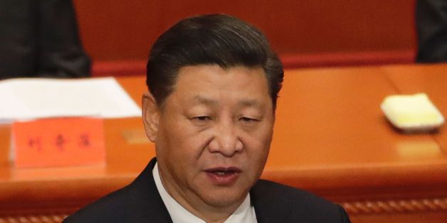 China's President Xi Jinping speaks during a ceremony to commemorate the 90th anniversary of the founding of the People's Liberation Army, at the Great Hall of the People in Beijing on August 1, 2017.China will fiercely protect its sovereignty against 'any people, organisation or political party', President Xi Jinping warned on August 1, as the country celebrated the 90th anniversary of its military, the People's Liberation Army. / AFP PHOTO / POOL / Andy Wong (Photo credit should read AN