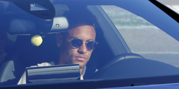 Brazilian soccer player Neymar drives to arrive to Joan Gamper training camp near Barcelona, Spain, August 2, 2017. REUTERS/Stringer