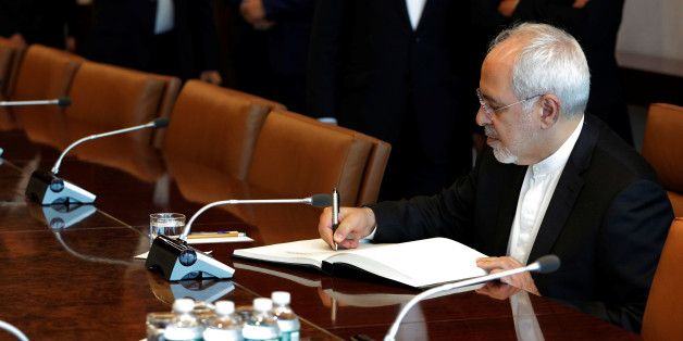 Iran's Foreign Minister Mohammad Javad Zarif signs a ceremonial book before a meeting at theU.N. headquarters in New York City, U.S., July 17, 2017. REUTERS/Lucas Jackson
