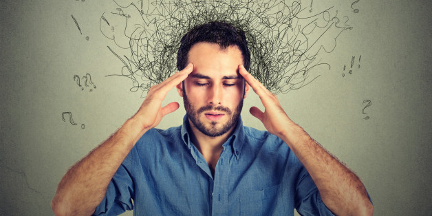 Closeup sad young man with worried stressed face expression and brain melting into lines question marks. Obsessive compulsive, adhd, anxiety disorders