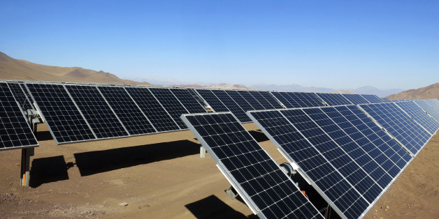 Solar panels of local mining company CAP are seen in the Atacama Desert June 5, 2014. CAP inaugurated the largest solar plant in Latin America with an area equivalent to 200 football fields and to generate enough power to meet almost all the electrical needs of an iron ore mine. The arid northern part of Chile and the southern Patagonia are ideal to generate, solar, wind or geothermal power. Picture taken June 5, 2014. REUTERS/Fabian Andres Cambero (CHILE - Tags: ENERGY ENVIRONMENT)