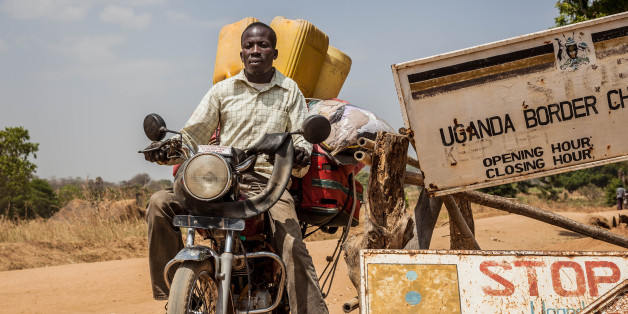 MOYO, UGANDA - FEBURARY 05: A man carrying luggage on his motorbike crosses the border at a formal crossing point on Feburary 05, 2017 in Moyo, Uganda.
PHOTOGRAPH BY Natalia Jidovanu / Le Pictorium / Barcroft Images
London-T:+44 207 033 1031 E:hello@barcroftmedia.com -
New York-T:+1 212 796 2458 E:hello@barcroftusa.com -
New Delhi-T:+91 11 4053 2429 E:hello@barcroftindia.com www.barcroftimages.com (Photo credit should read Natalia J/LePictorium/Barcroft / Barcroft Media via Getty Images)