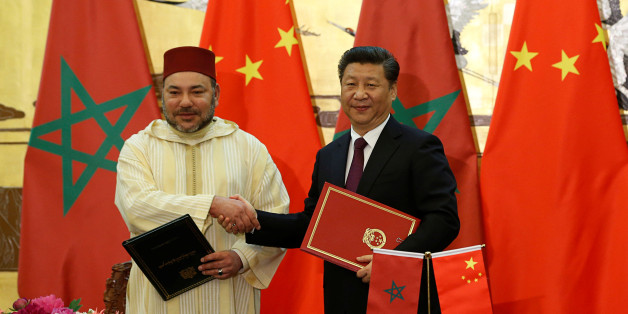 China's President Xi Jinping (R) and Moroccan King, Mohammed VI, shake hands after signing documents during a signing ceremony at the Great Hall of People in Beijing, China, May 11, 2016. REUTERS/Kim Kyung-Hoon