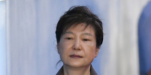 South Korea's ousted president Park Geun-Hye arrives at the Seoul Central District Court in Seoul on August 7, 2017 for her trial over the massive corruption scandal that led to her downfall.South Korean prosecutors on August 7 demanded the heir to the Samsung empire be jailed for 12 years over his role in the corruption scandal that brought down the country's last president. / AFP PHOTO / JUNG Yeon-Je (Photo credit should read JUNG YEON-JE/AFP/Getty Images)
