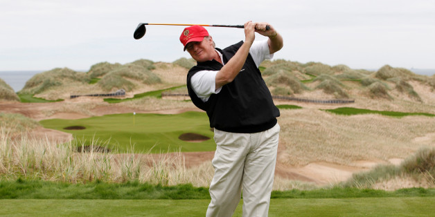 U.S. property magnate Donald Trump practices his swing at the 13th tee of his new Trump International Golf Links course on the Menie Estate near Aberdeen, Scotland, Britain June 20, 2011. To match Special Report USA-ELECTION/TRUMP-GOLF REUTERS/David Moir/File Photo