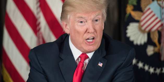 US President Donald Trump speaks about North Korea at a meeting with administration officials on the opioid addiction crisis at the Trump National Golf Club in Bedminster, New Jersey, on August 8, 2017. / AFP PHOTO / NICHOLAS KAMM (Photo credit should read NICHOLAS KAMM/AFP/Getty Images)