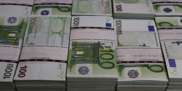 Wads of 100 euro banknotes are stacked in a pile at the Money Service Austria company's headquarters in Vienna, Austria, March 3, 2016. REUTERS/Leonhard Foeger