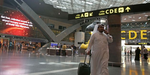 Passengers walk in the departures lounge at the Hamad International Airport in Doha on July 20, 2017. / AFP PHOTO / STRINGER (Photo credit should read STRINGER/AFP/Getty Images)
