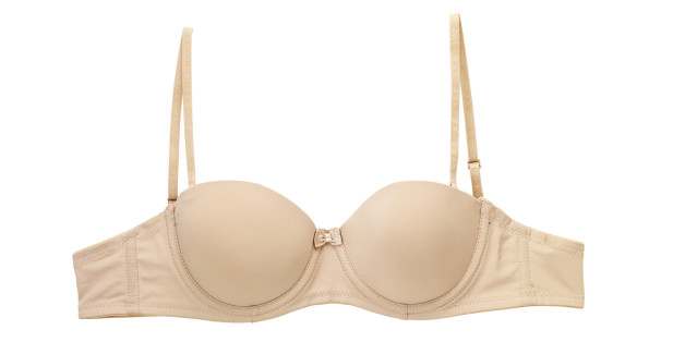 woman measured her huge breast with a measuring tape