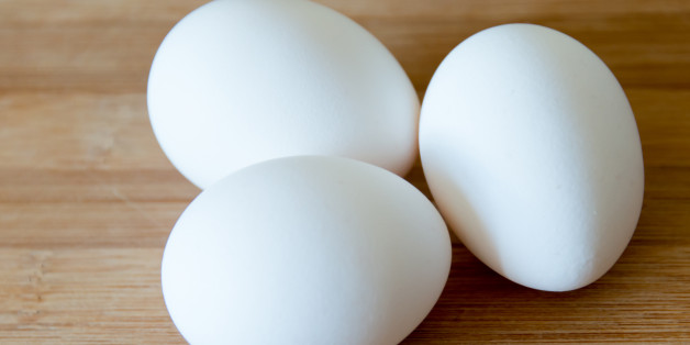 TORONTO, ONTARIO, CANADA - 2015/03/30: Eggs: realistic approach to food ingredients. Three white eggs over a wooden surface or cutting board in a kitchen, some shallow depth of field and natural lightning. (Photo by Roberto Machado Noa/LightRocket via Getty Images)