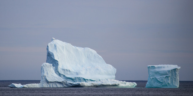 FERRYLAND, NEWFOUNDLAND - APRIL 26: A large iceberg floats in the Atlantic Ocean, April 26, 2017 off the coast of Ferryland, Newfoundland, Canada. Icebergs break off from Baffin Island and Greenland every spring and drift down the stretch of water along the coast of Newfoundland and Labrador known as Iceberg Alley. According to media reports, the higher number of icebergs this season can be attributed to uncommonly strong counter-clockwise winds that draw the icebergs south and possibly global w