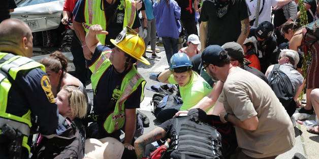 CHARLOTTESVILLE, VA - AUGUST 12: Rescue workers and medics tend to many people who were injured when a car plowed through a crowd of anti-facist counter-demonstrators marching through the downtown shopping district August 12, 2017 in Charlottesville, Virginia. The car plowed through the crowed following the shutdown of the 'Unite the Right' rally by police after white nationalists, neo-Nazis and members of the 'alt-right' and counter-protesters clashed near Lee Park, where a statue of Confedera