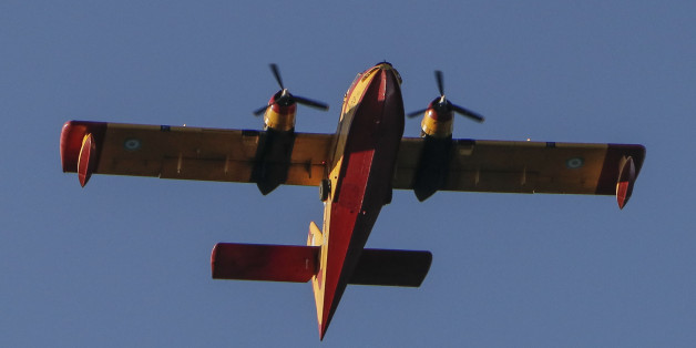Fire that took place in Lavrio area, a port connecting Athens to islands. The fire started from the flat land end moved on the hills covered by little trees and bushes, near houses. During the fire on 7 of July 2017, Canadair CL-215 firefighting planes tried to operate, but due to strong wind gusts couldn't, so firefighting helicopters replaced them. Greece during the summer, specially with high temperatures and winds, is on high alert for fires. (Photo by Nicolas Economou/NurPhoto via Getty Images)
