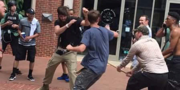 A white supremacist protester (L-in black) is chased and attacked by counter protesters after giving a Nazi salute during "Unite the Right" protests by white nationalist and "alt-right" demonstrators in Charlottesville, Virginia, U.S., August 12, 2017. REUTERS/Casey Ian Patchell