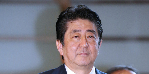 Japan's Prime Minister Shinzo Abe arrives at his official residence in Tokyo on August 15, 2017.Abe sent a cash donation to a controversial war shrine as the country marked the anniversary of its defeat in World War II. Yasukuni Shrine honours millions of mostly Japanese war dead, but is contentious for also enshrining senior military and political figures convicted of war crimes by an international tribunal. / AFP PHOTO / JIJI PRESS / STR / Japan OUT (Photo credit should read STR/AFP/Get