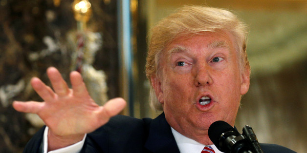 U.S. President Donald Trump reacts to questions about the violent protests in Charlottesville, Virginia while speaking at his Trump Tower residence in New York, U.S., August 15, 2017. REUTERS/Kevin Lamarque