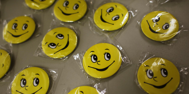Badges for participants of a Laughter Yoga class are displayed before a exercise for the staff at Ocean Park in Hong Kong July 10, 2014. Consultancy firm ?Inspire 2 Aspire? run Laughter Yoga classes for corporations which partner Mahesh Pamnani believes ease stress and increases productivity and creativity among staff. Laughter Yoga was first developed 1995 in Mumbai, India by Dr. Madan Kataria, and has over 600 clubs in 60 countries, according to Laughter Yoga International. REUTERS/Bobby Yip