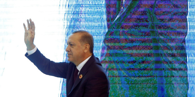 Turkish President Tayyip Erdogan greets the audience during a ceremony to mark the 16th anniversary of his ruling AK Party's foundation in Ankara, Turkey, August 14, 2017. REUTERS/Umit Bektas