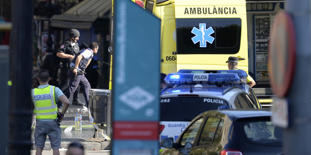 Armed policemen arrive in a cordoned off area after a van ploughed into the crowd, injuring several persons on the Rambla in Barcelona on August 17, 2017.
Police in Barcelona said they were dealing with a 'terrorist attack' after a vehicle ploughed into a crowd of pedestrians on the city's famous Las Ramblas boulevard on August 17, 2017. Police were clearing the area after the incident, which has left a number of people injured. / AFP PHOTO / Josep LAGO (Photo credit should read JOSEP LAGO/AFP/Getty Images)