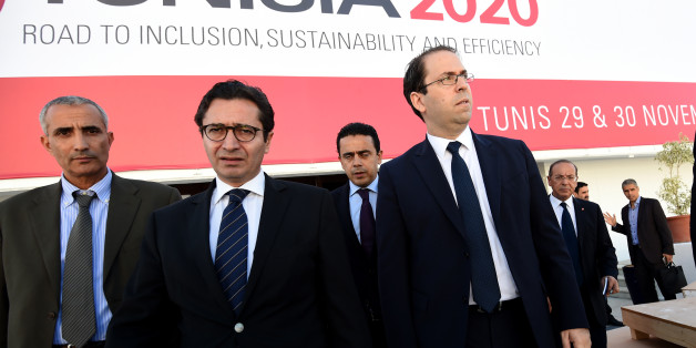 Tunisian Prime Minister Youssef Chahed (R) and Tunisia's Investment and International Cooperation Minister Fadhel Abdelkefi (C) arrive to inspect the final preparation at the Congress Palace in the capital Tunis, on November 27, 2016, two days ahead of the opening ceremony of the 'Tunisia 2020' conference.
Tunisia will host 2,000 business and finance executives from 40 countries this week in hopes of drumming up investment to boost its struggling economy. / AFP / FETHI BELAID (Photo credit should read FETHI BELAID/AFP/Getty Images)