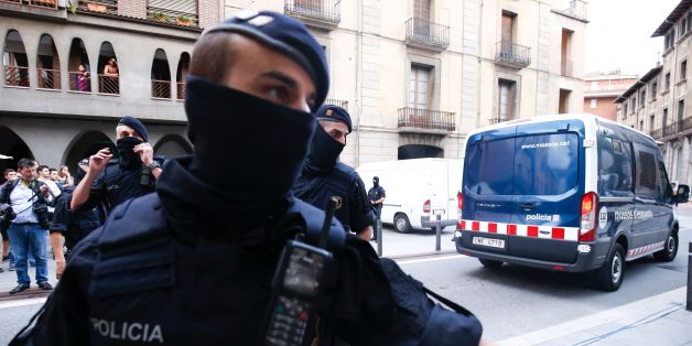 Catalan autonomous police officers, known as Mosso d'Esquadra, block a road after detaining a suspect in Ripoll following a search linked to the deadly terror attacks in Barcelona and the seaside resort of Cambrils, a day after a van ploughed into the crowd, killing 14 persons and injuring over 100 on the Rambla in Barcelona.
Drivers have ploughed on August 17, 2017 into pedestrians in two quick-succession, separate attacks in Barcelona and another popular Spanish seaside city, leaving 14 people dead and injuring more than 100 others. / AFP PHOTO / PAU BARRENA (Photo credit should read PAU BARRENA/AFP/Getty Images)