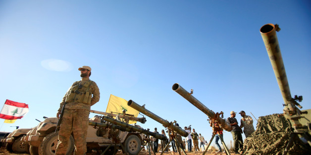 A Hezbollah fighter stands in front of anti-tank artillery at Juroud Arsal, the Syria-Lebanon border, July 29, 2017. REUTERS/Ali Hashisho TPX IMAGES OF THE DAY