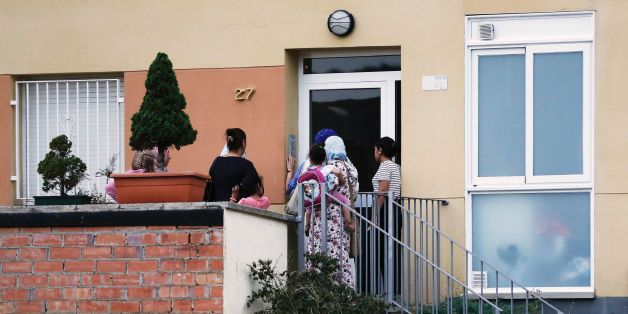 People ring the doorbell of the flat of the Oukabir family in Ripoll, after police carried out a search linked to the deadly terror attacks in Barcelona and the seaside resort of Cambrils on August 18, 2017, a day after a van ploughed into the crowd, killing 13 persons and injuring over 100 on the Rambla in Barcelona.
Drivers have ploughed on August 17, 2017 into pedestrians in two quick-succession, separate attacks in Barcelona and another popular Spanish seaside city, leaving 14 people dead and injuring more than 100 others. / AFP PHOTO / PAU BARRENA (Photo credit should read PAU BARRENA/AFP/Getty Images)