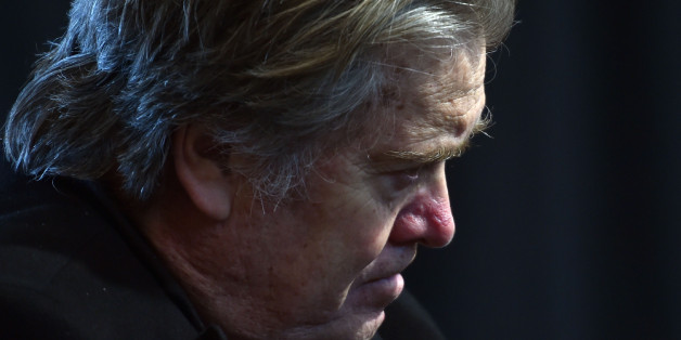 Assistant and White House chief strategist to US President Donald Trump, Steve Bannon listens as Trump delivers remarks with auto industry executives at American Center for Mobility in Ypsilanti, Michigan on March 15, 2017. / AFP PHOTO / Nicholas Kamm (Photo credit should read NICHOLAS KAMM/AFP/Getty Images)